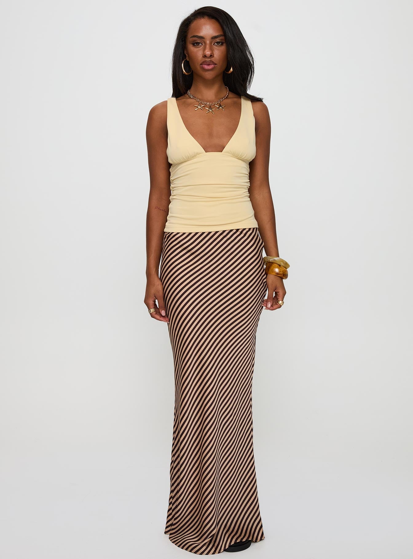 Featuring the Eliena Maxi Skirt Multi Petite in womens-skirts with maxi length and striped print front view of model wearing