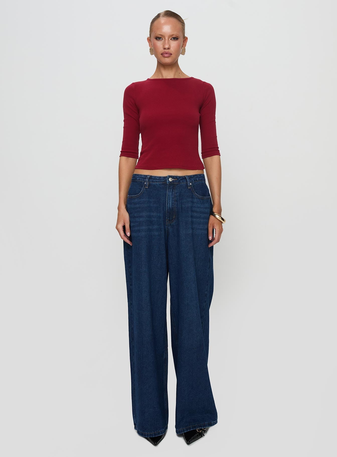 front view of model wearing Princess Polly Elaia 3/4 Sleeve Top Red Three Fourth Sleeves Crew Neck 