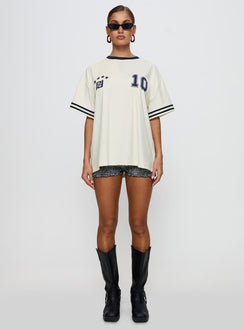 side view of model wearing Princess Polly Cornwall Football Jersey Cream Half Sleeves Crew Neck 