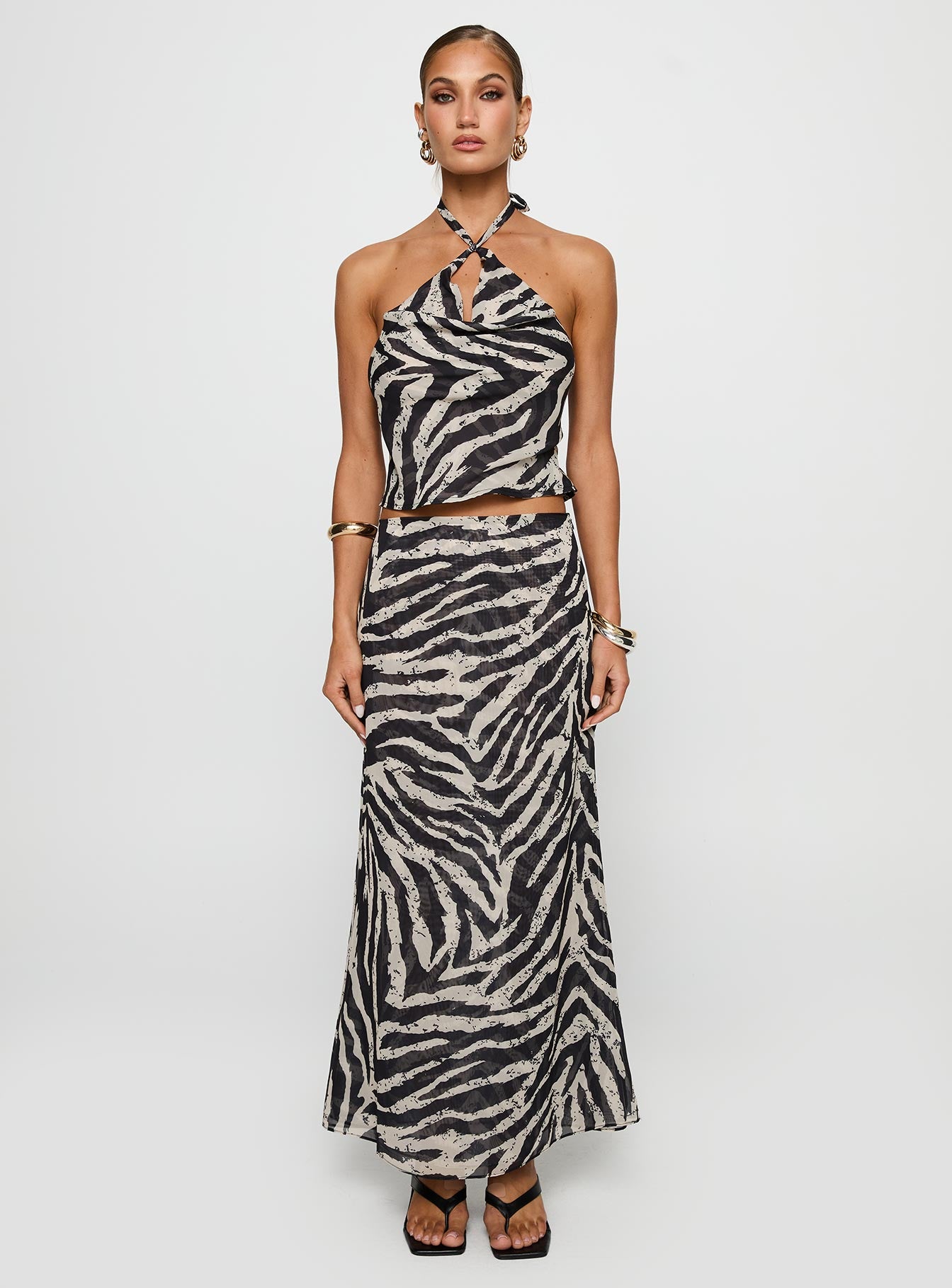 side view of model wearing Princess Polly Eleganza Top Zebra Sleeveless Cowl 