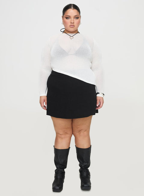 side view of model wearing Princess Polly Pratt Long Sleeve Top White Curve Full Sleeves High Neck 