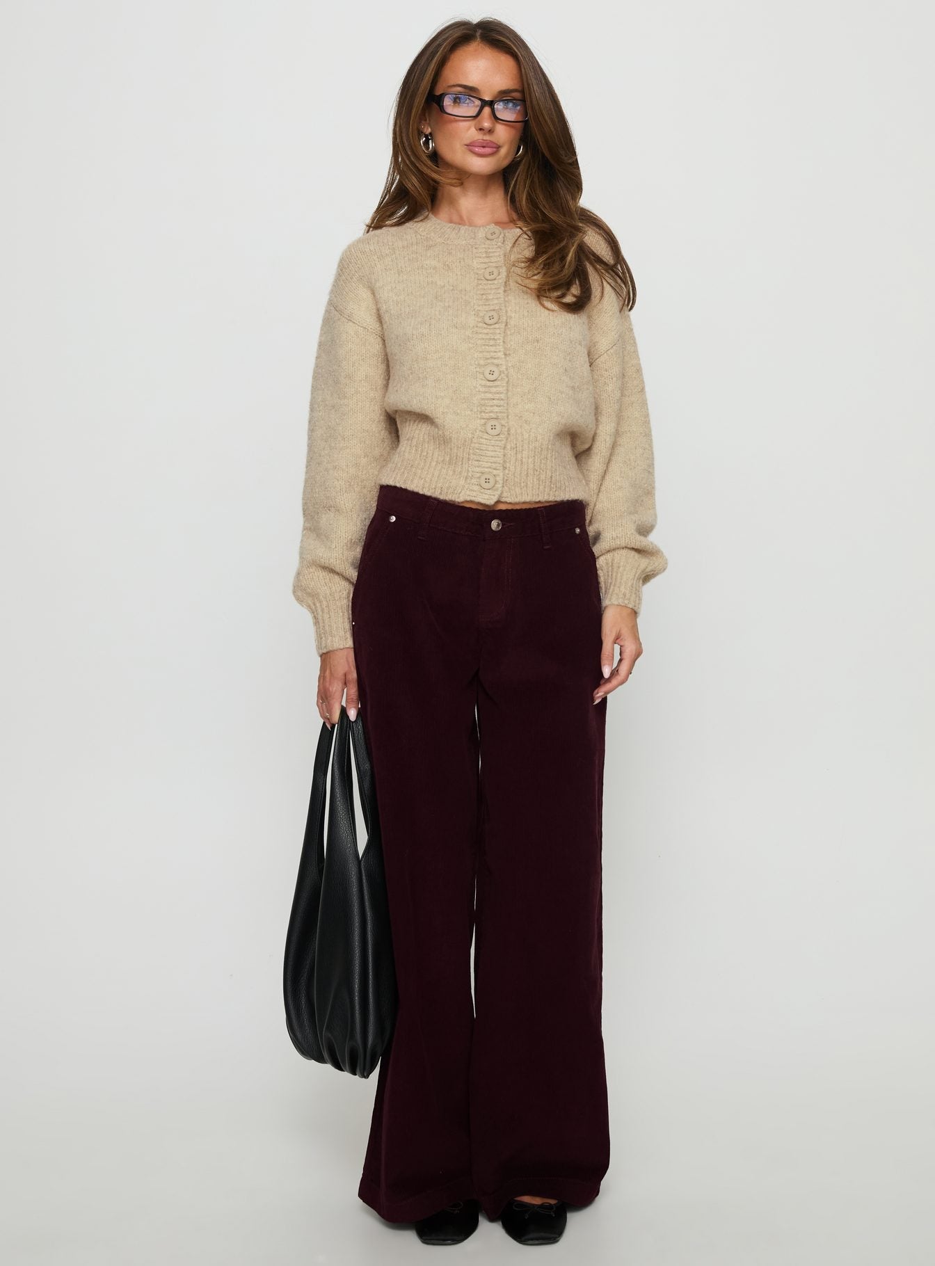 front view of model wearing Princess Polly Jacynda Low Waist Wide Leg Corduroy Jeans Currant Mid Rise Jeans 