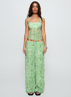 side view of model wearing Princess Polly Finesse Pants Green Floral High Waisted Pants 
