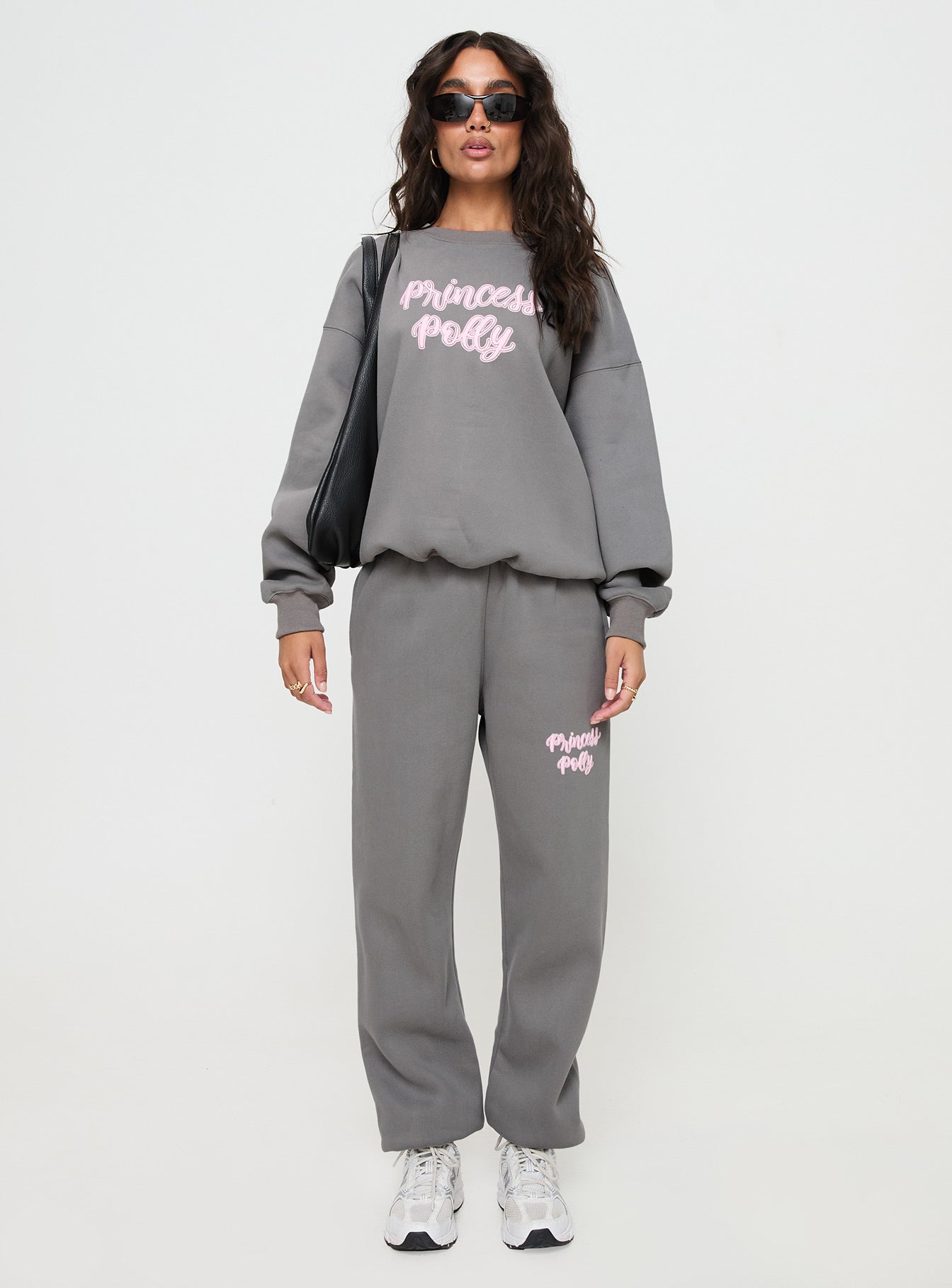front view of model wearing Princess Polly Princess Polly Crew Neck Sweatshirt Puff Text Charcoal Long 