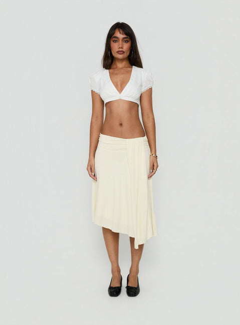 Crafted from cornsilk fabric, the Iselda Draped Midi Skirt Cream in womens-skirts features asymmetry Princess Polly