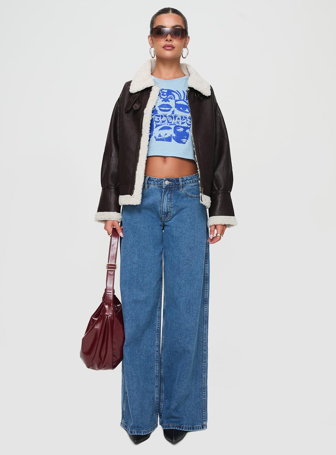 Faux leather jacket Classic collar, exposed zip fastening, twin pockets, buckle detail