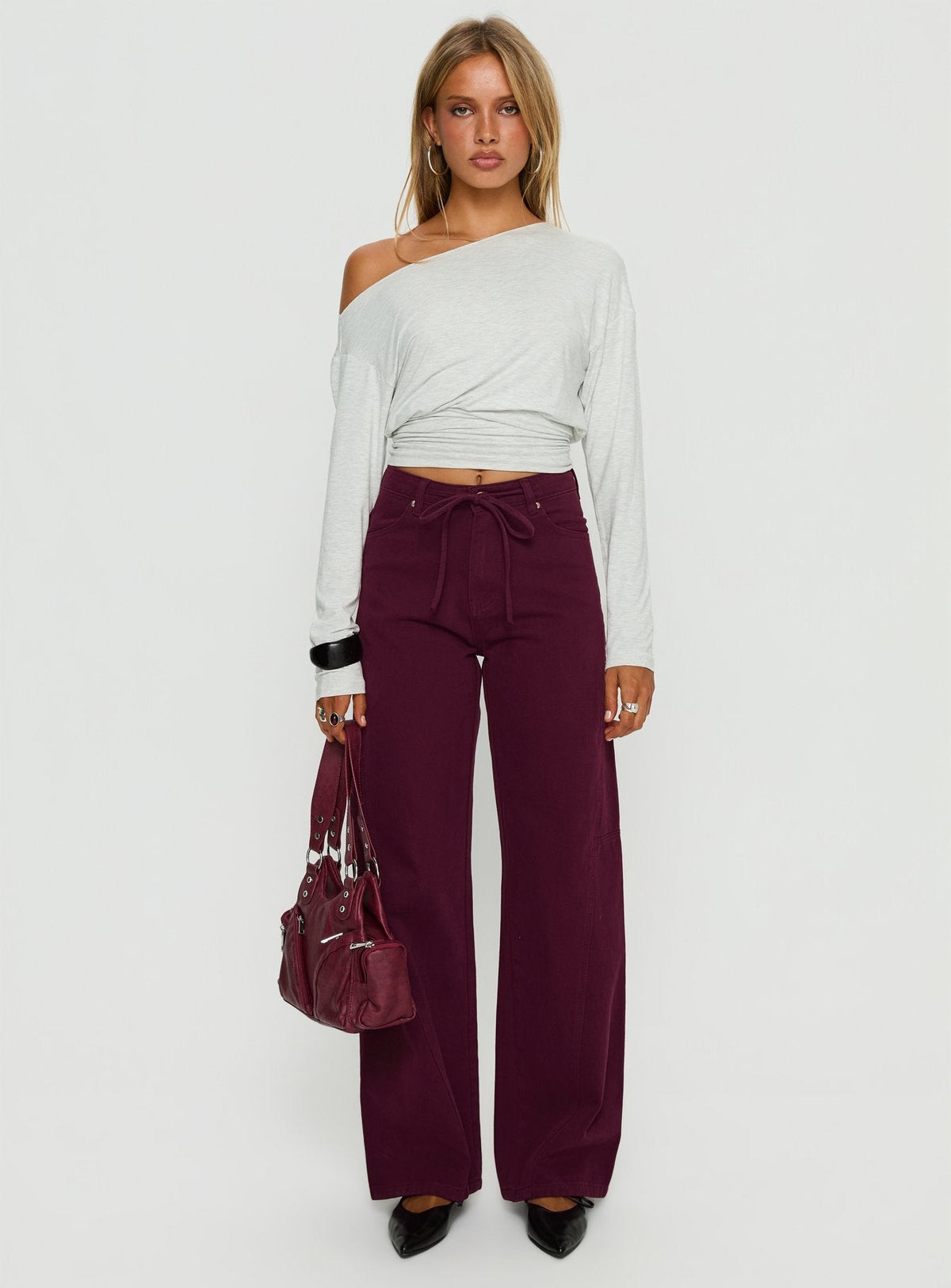 side view of model wearing Princess Polly Bruiser Tie Waist Mid Rise Wide Leg Jeans Currant High Rise Jeans Jeans 