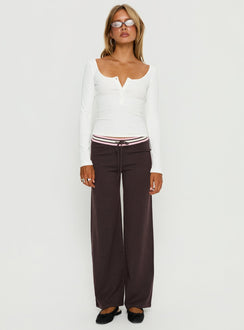 side view of model wearing Princess Polly Felisha Low Waist Knit Pants Brown Low Rise Pants 