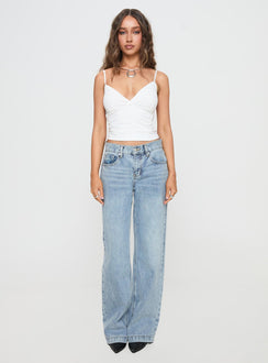 front view of model wearing Princess Polly Anelli Low Rise Straight Leg Jeans Light Blue Wash High Waisted 