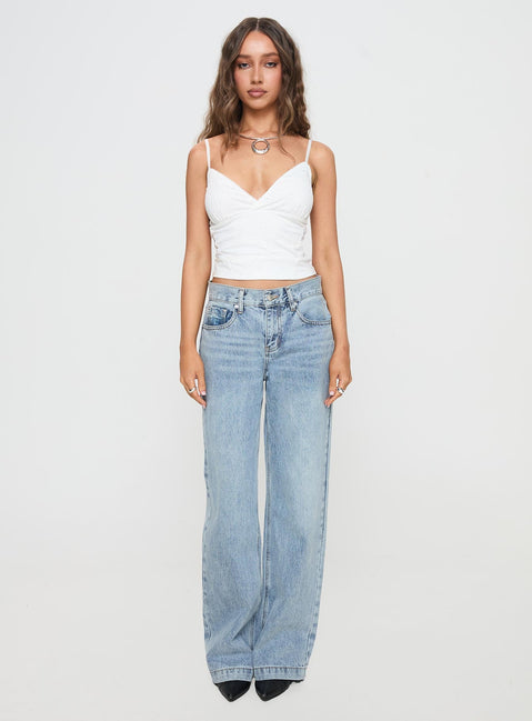 front view of model wearing Princess Polly Anelli Low Rise Straight Leg Jeans Light Blue Wash High Waisted 