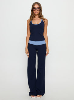 side view of model wearing Princess Polly Kobee Jersey Flare Pants Navy / Light Blue High Rise Pants 