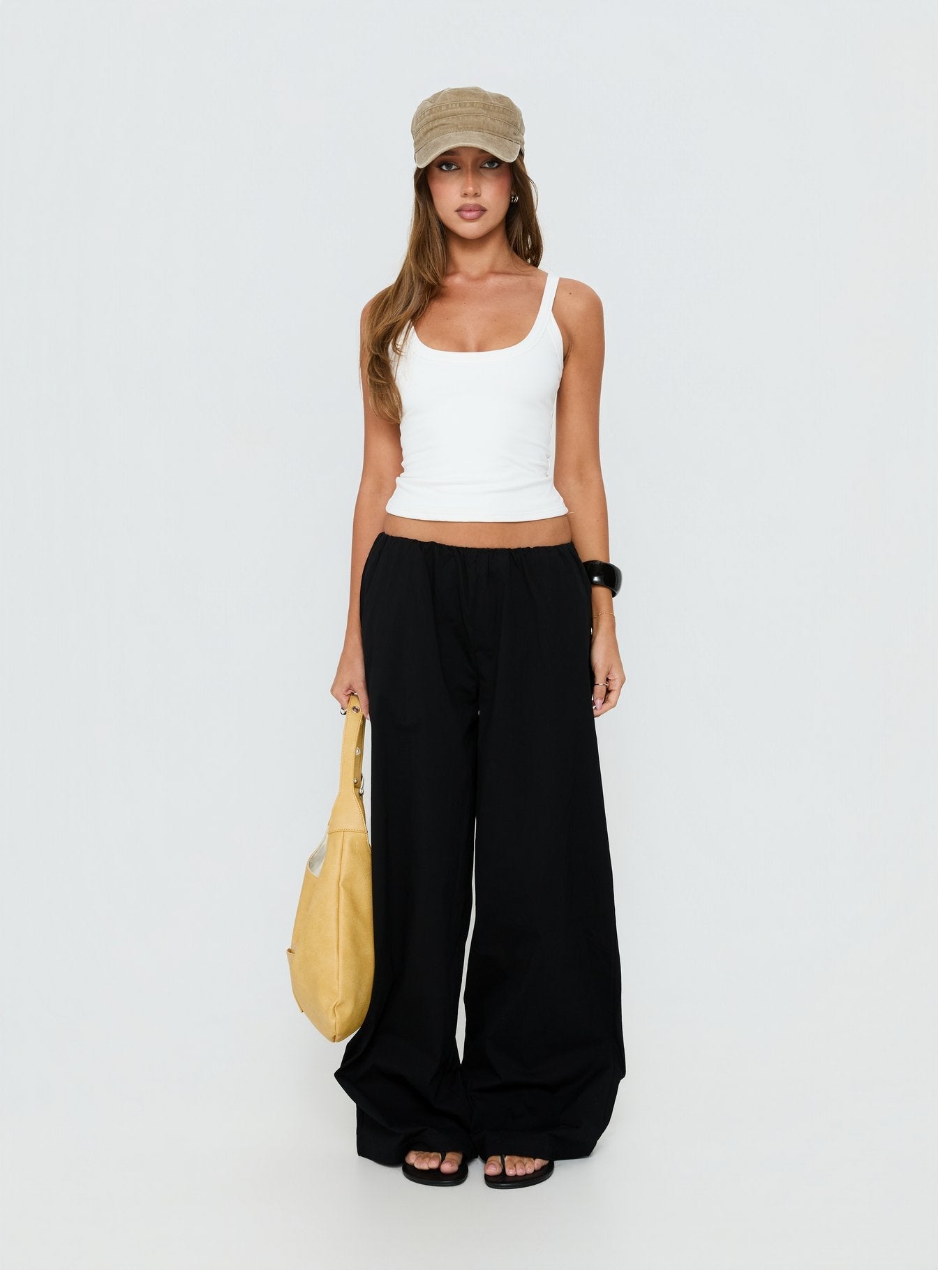 Showcasing Lunea Concealed Waistband Pants Black in womens-regular-pants with high-rise front view of model wearing Princess Polly