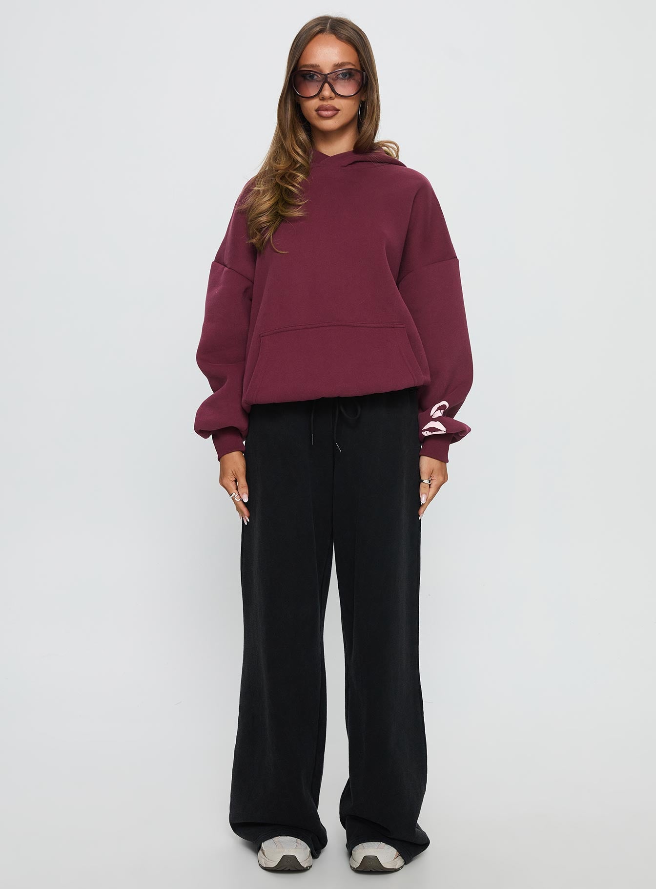 front view of model wearing Princess Polly Kisses Graphic Hoodie Wine Longline Jumpers 