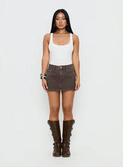   side view of model wearing Princess Polly Nicolina Low Rise Denim Mini Skirt Washed Brown Mini Skirts 