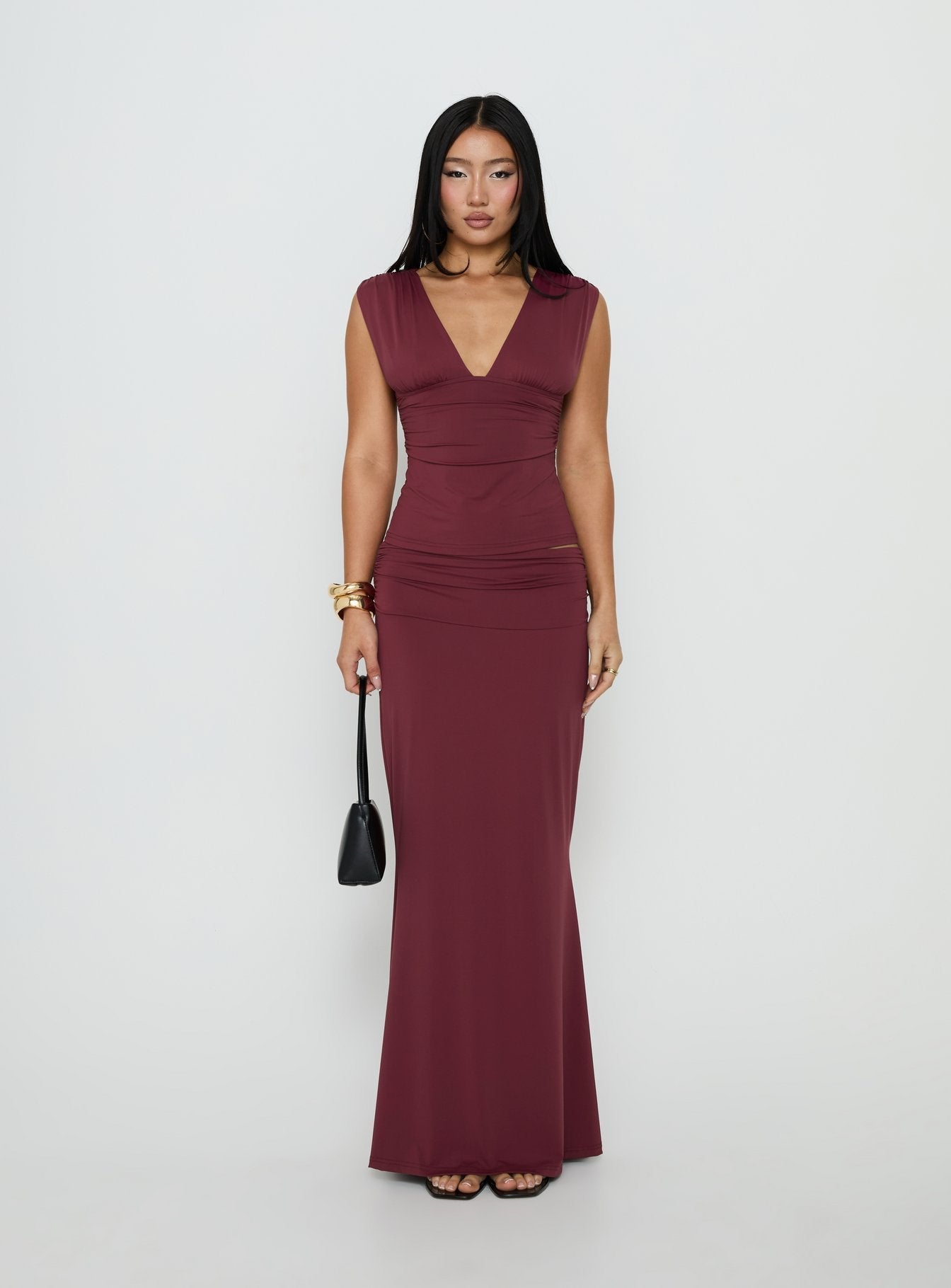 Showcasing the Liorah Foldover Waist Maxi Skirt Red in womens-skirts with a maxi length front view of model wearing Princess Polly