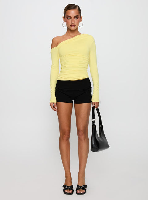 back view of model wearing Princess Polly Beller Long Sleeve Top Lemon Full Sleeves Asymmetric Neckline 
