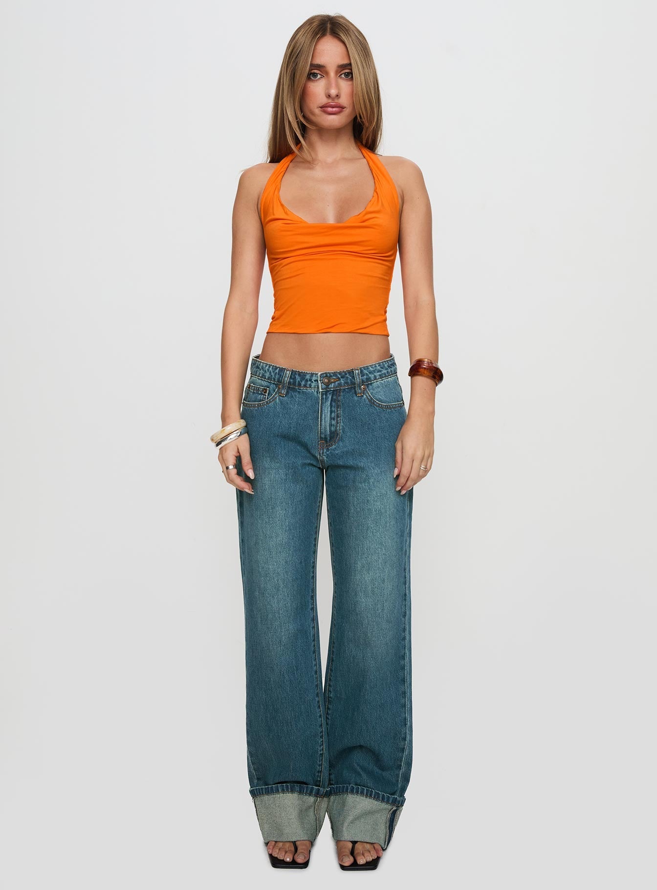 front view of model wearing Princess Polly Toros Mid Rise Wide Leg Foldover Denim Jeans Mid Blue Low Rise Jeans 