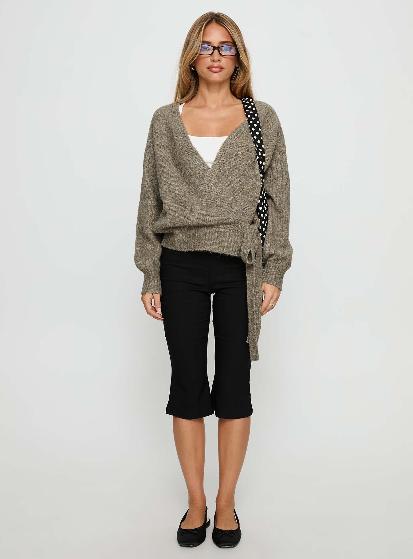 side view of model wearing Princess Polly Daelan Wrap Knit Cardigan Brown regular 