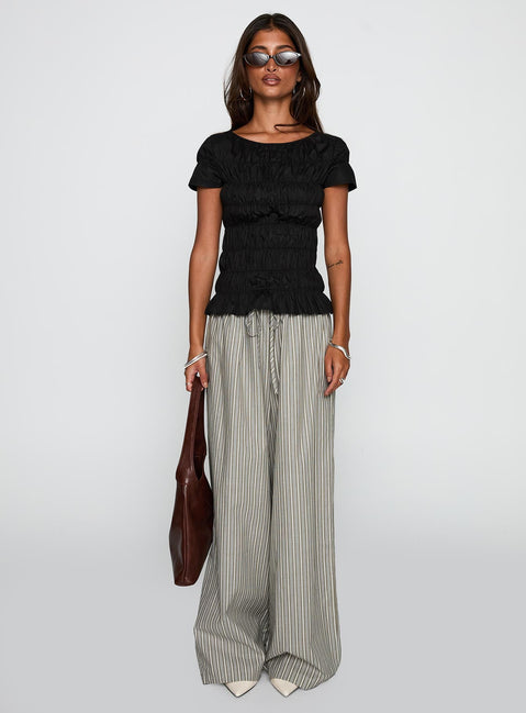front view of model wearing Princess Polly Spoiler Alert Ruched Top Black Short Sleeves Scoop Neck 
