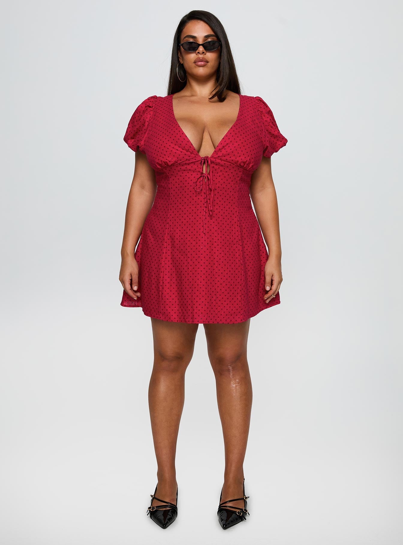 side view of model wearing Princess Polly Beloved Puff Sleeve Linen Blend Mini Dress Red Polka Curve Plunger 
