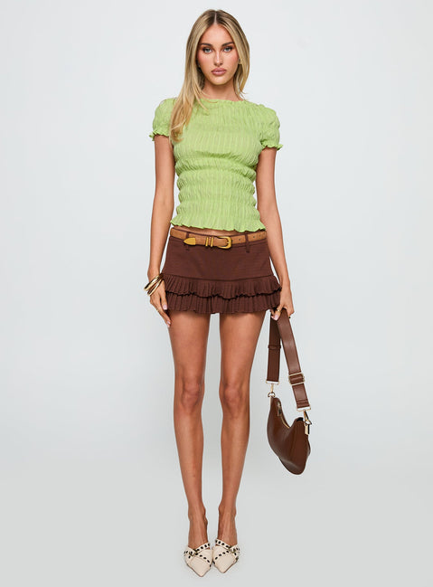 front view of model wearing Princess Polly Romelle Shirred Top Lime Short Sleeves High Neck 