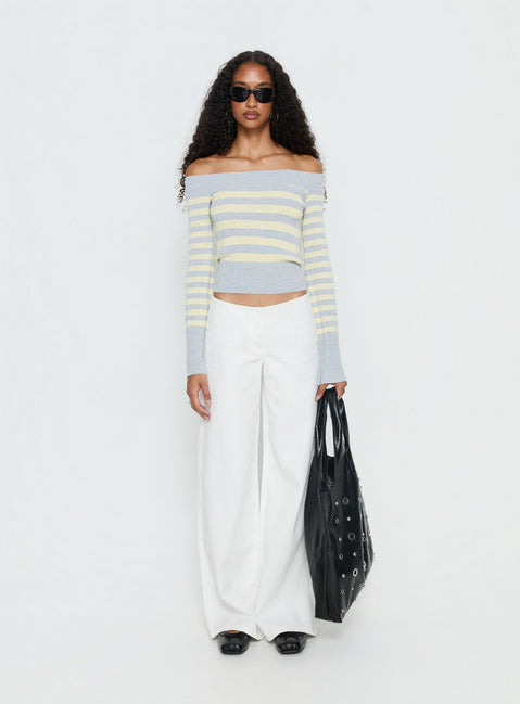 side view of model wearing Princess Polly Hereos Mid Rise Baggy Leg Jeans White Mid Rise Jeans 