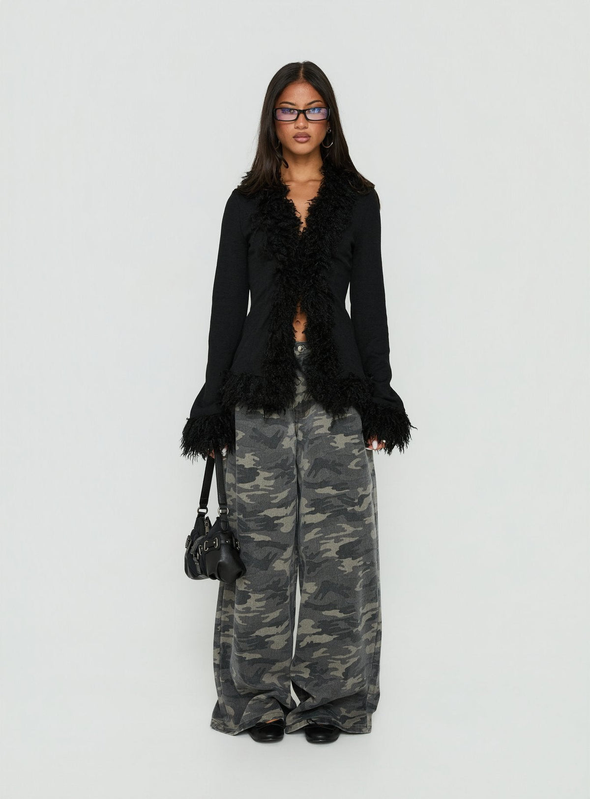 Highlighting the Brynlie Faux Fur Trim Boxy Cardigan in Black womens-jumpers with short length on-body view of model wearing Princess Polly