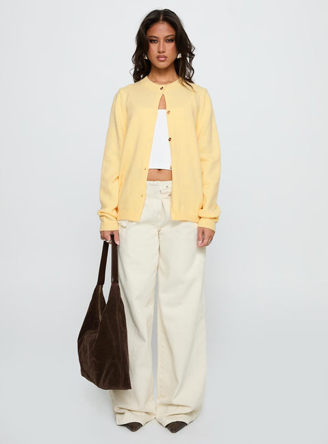 side view of model wearing Princess Polly Arica Button Up Knit Cardigan Lemon Long 