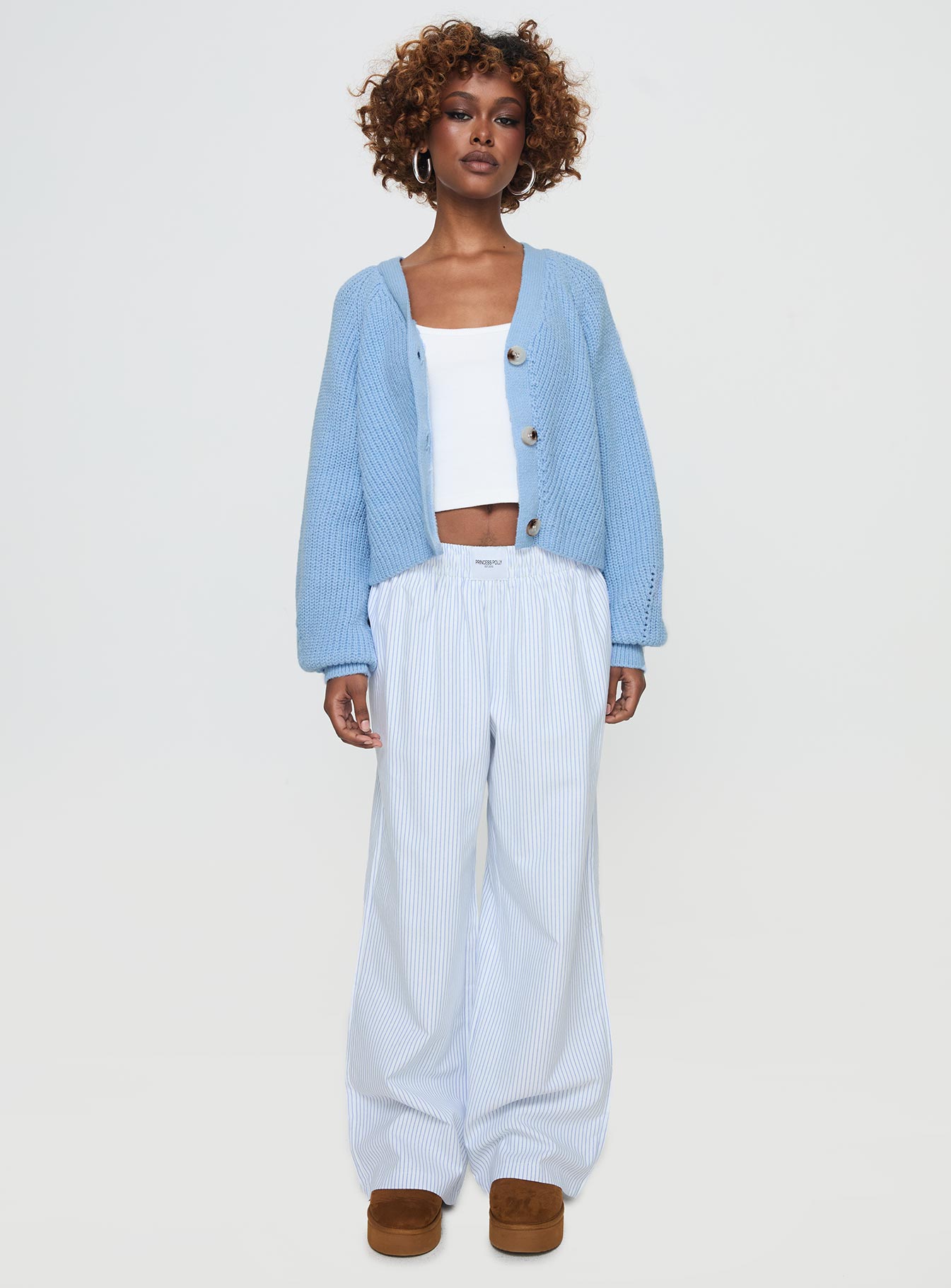 front view of model wearing Princess Polly Leskie Cardigan Pale Blue Cropped 