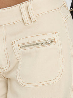 side view of model wearing Princess Polly Lifetimes Mid Rise Wide Leg Cargo Jeans Cream Mid Rise Jeans Jeans 