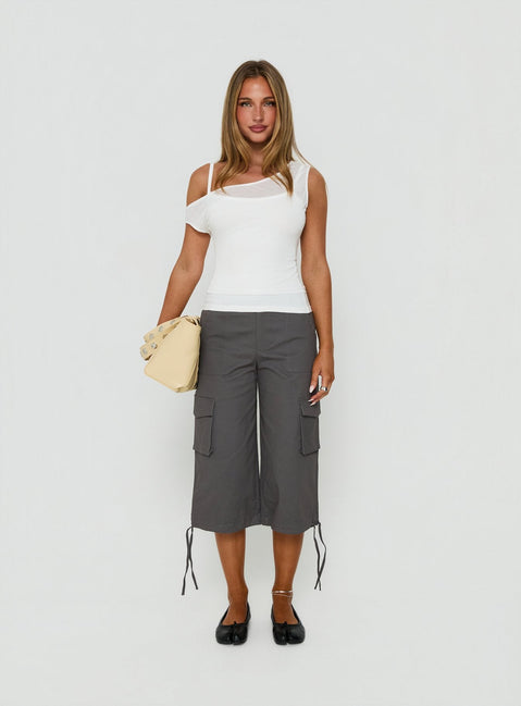 Featuring the Alfonza Utility Capri in Slate womens-regular-pants with mid-rise cargo styling front view of model wearing Princess Polly