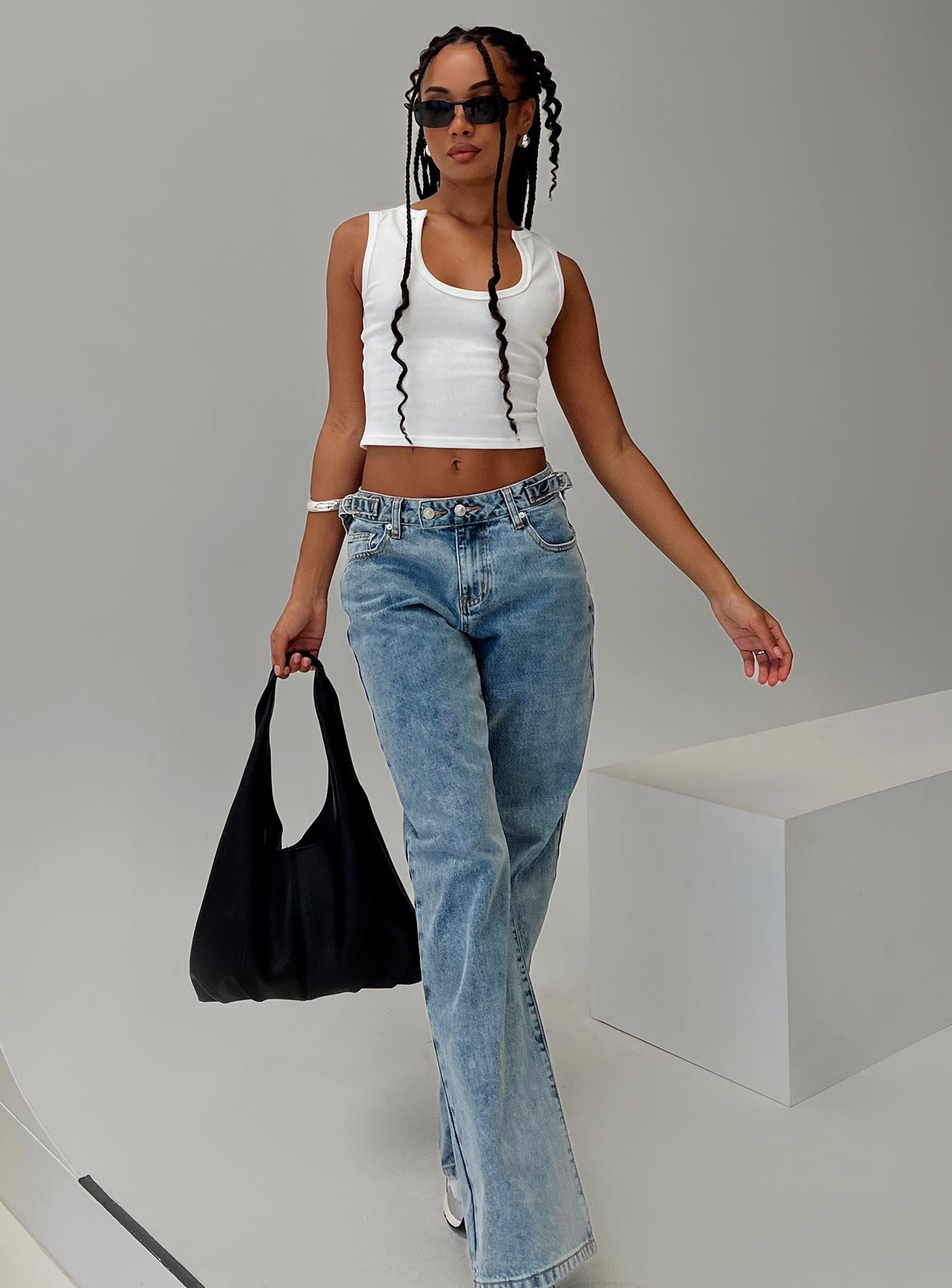 side view of model wearing Princess Polly Somer Top White Sleeveless Scoop Neck 