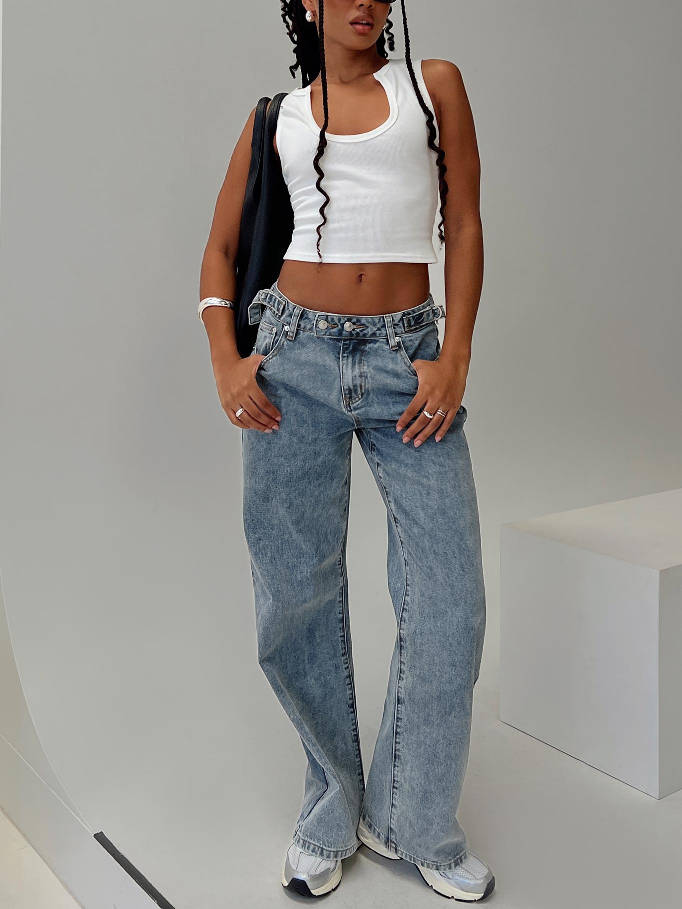 front view of model wearing Princess Polly Sidle Low Rise Jeans Light Wash Low Rise Jeans 