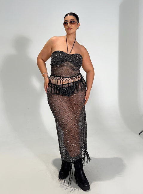   side view of model wearing Princess Polly Alnet Maxi Skirt Black Curve Maxi 