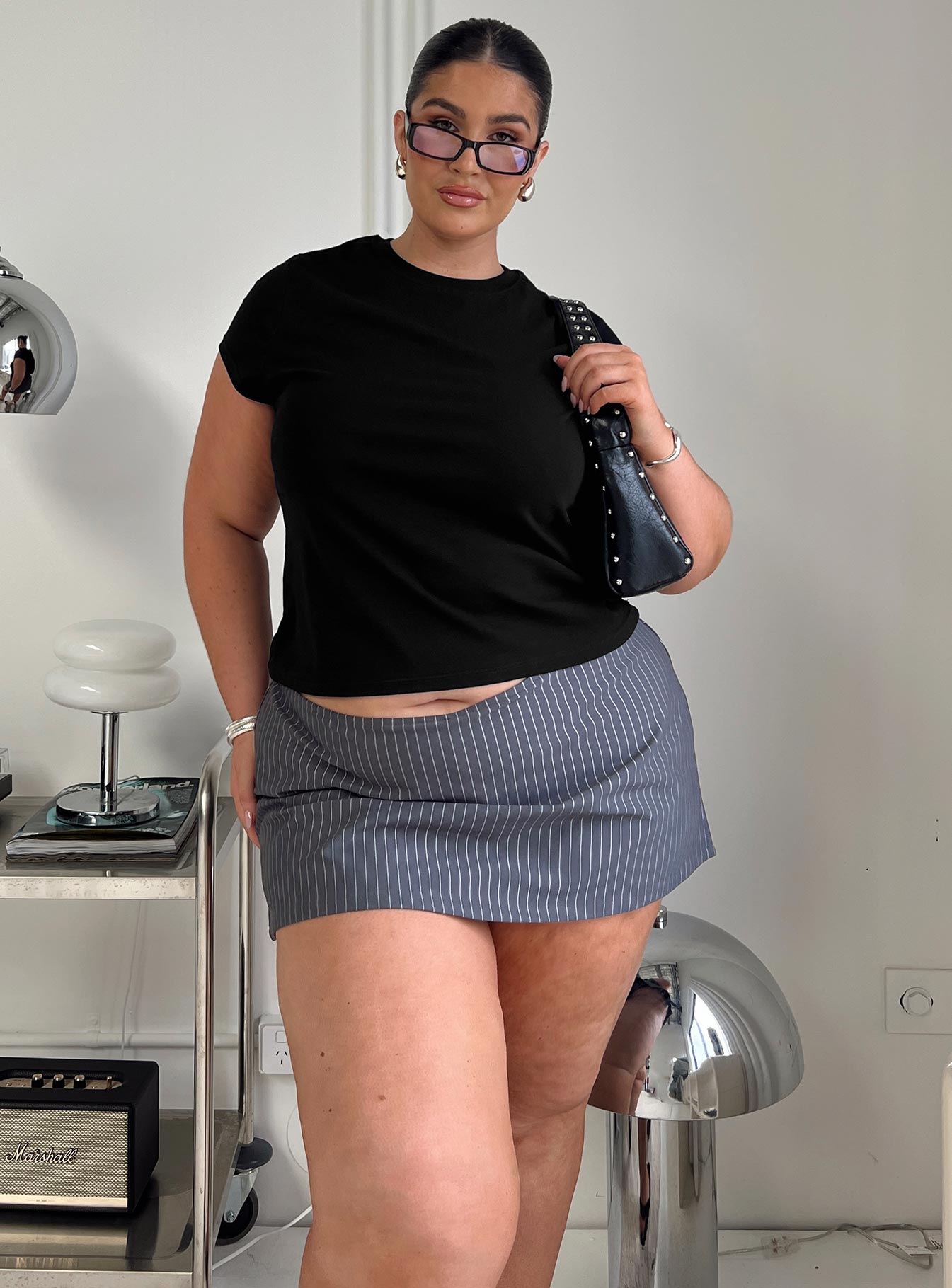 front view of model wearing Princess Polly Prestige Longline Baby Tee Black Curve Short Sleeves Crew Neck 