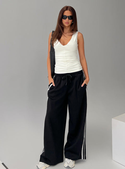 front view of model wearing Princess Polly Loving Is Easy Ruched Top White Sleeveless V-Neck 