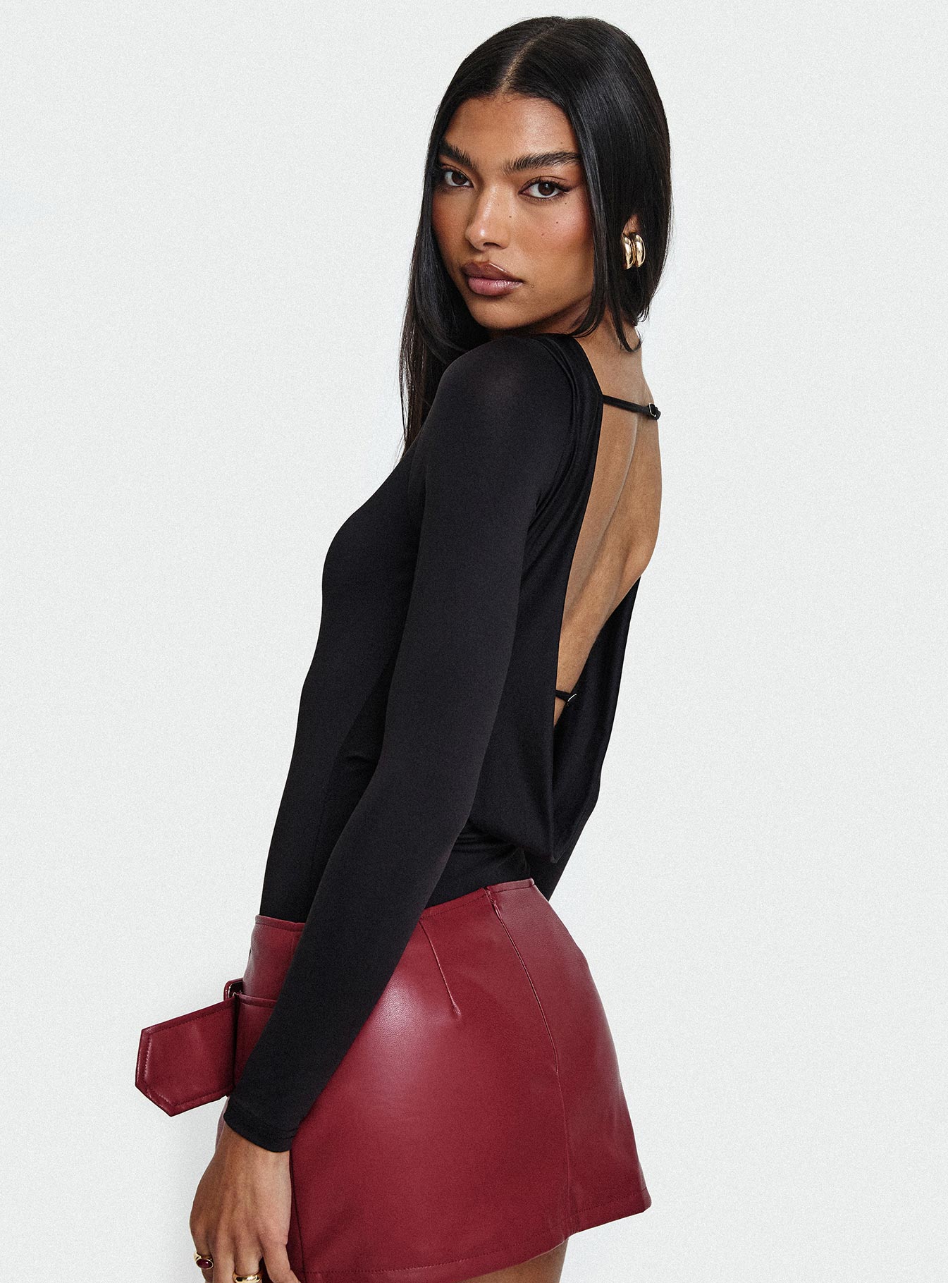 side view of model wearing Princess Polly Quinby Backless Long Sleeve Bodysuit Full Sleeves High Neck 