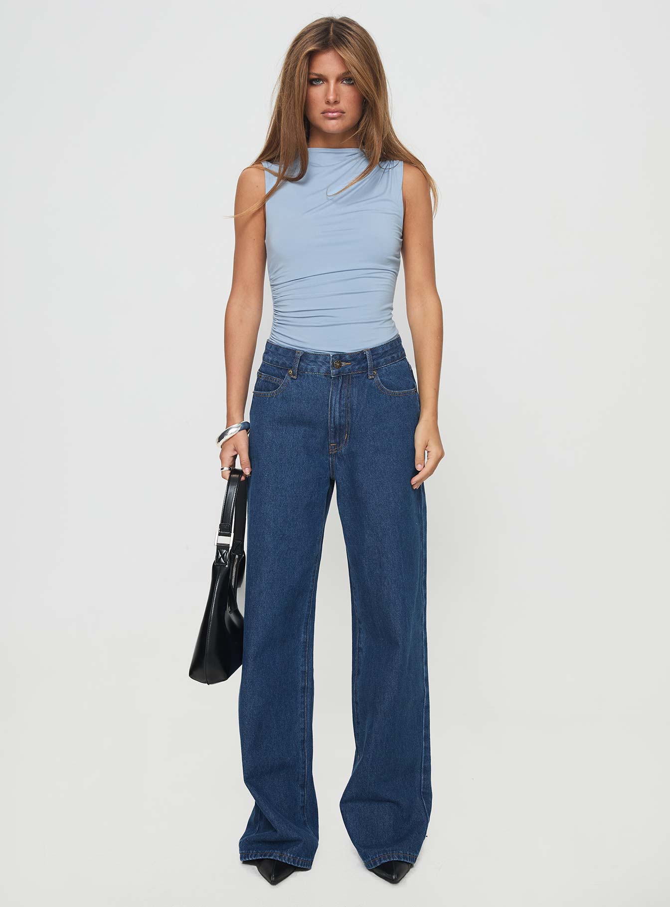 side view of model wearing Princess Polly Josefine Bodysuit Baby Blue Sleeveless High Neck 