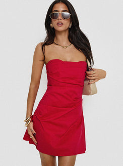 side view of model wearing Princess Polly Bradwell Strapless Mini Dress Red Sweetheart Neckline 