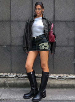   side view of model wearing Princess Polly Standout Patch Detail Denim Skort Blue Mini Skirts Skirts 