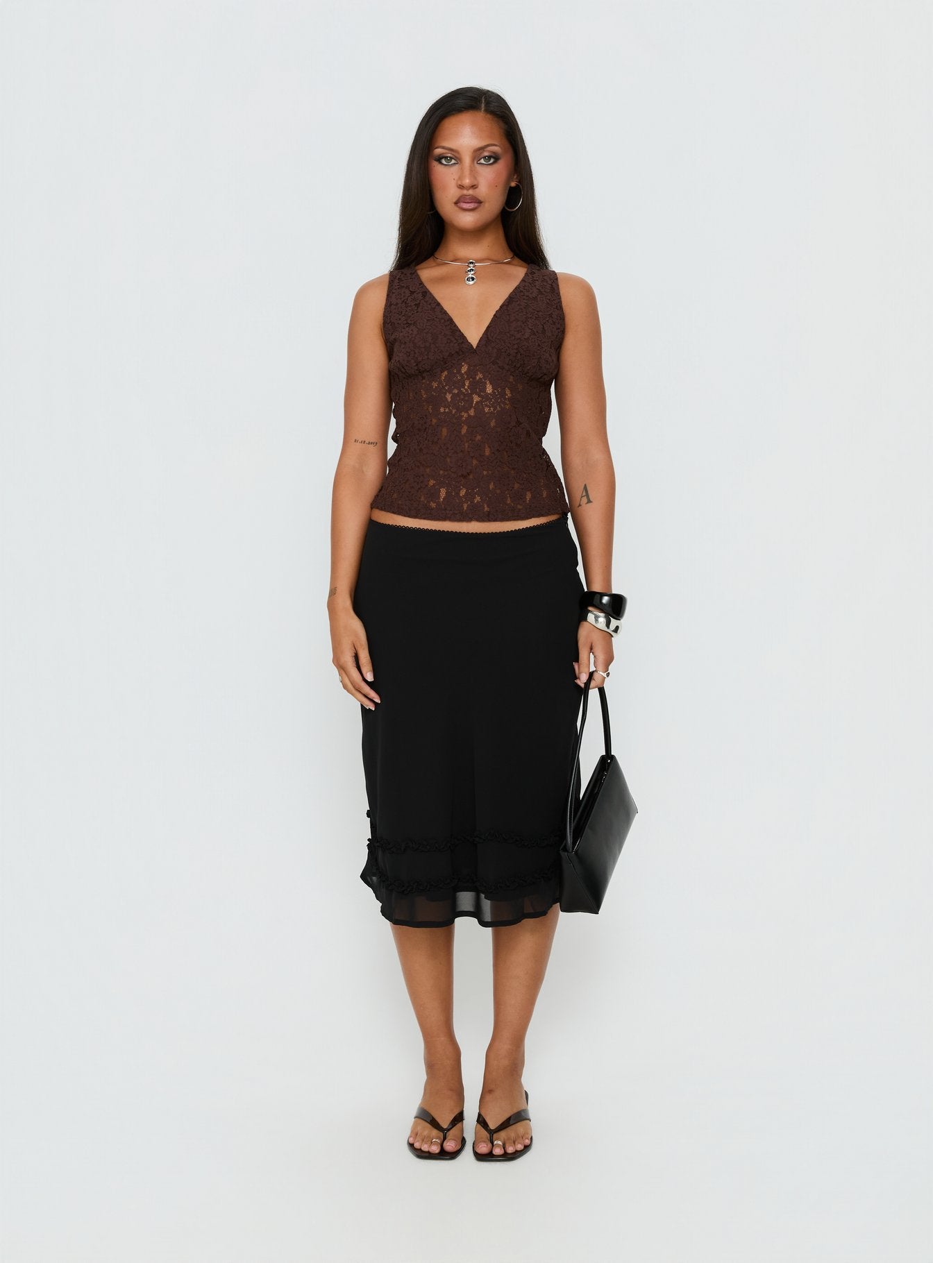   side view of model wearing Princess Polly Clarabella Frill Midi Skirt Black Midi Skirts 