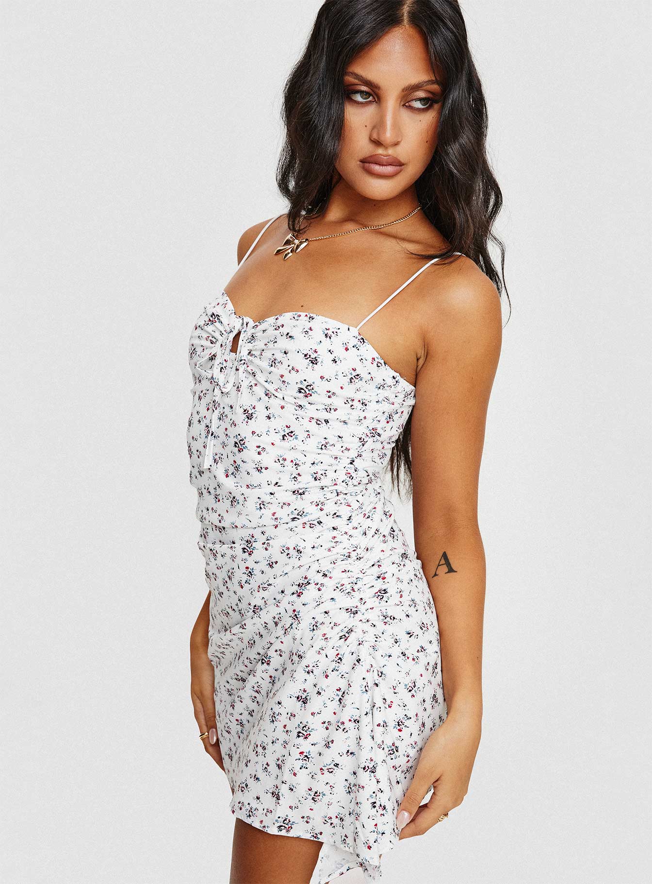 Floral mini dress Elasticated shoulder straps, sweetheart neckline, tie fastening at bust, invisible zip fastening at side, adjustable ruching at side