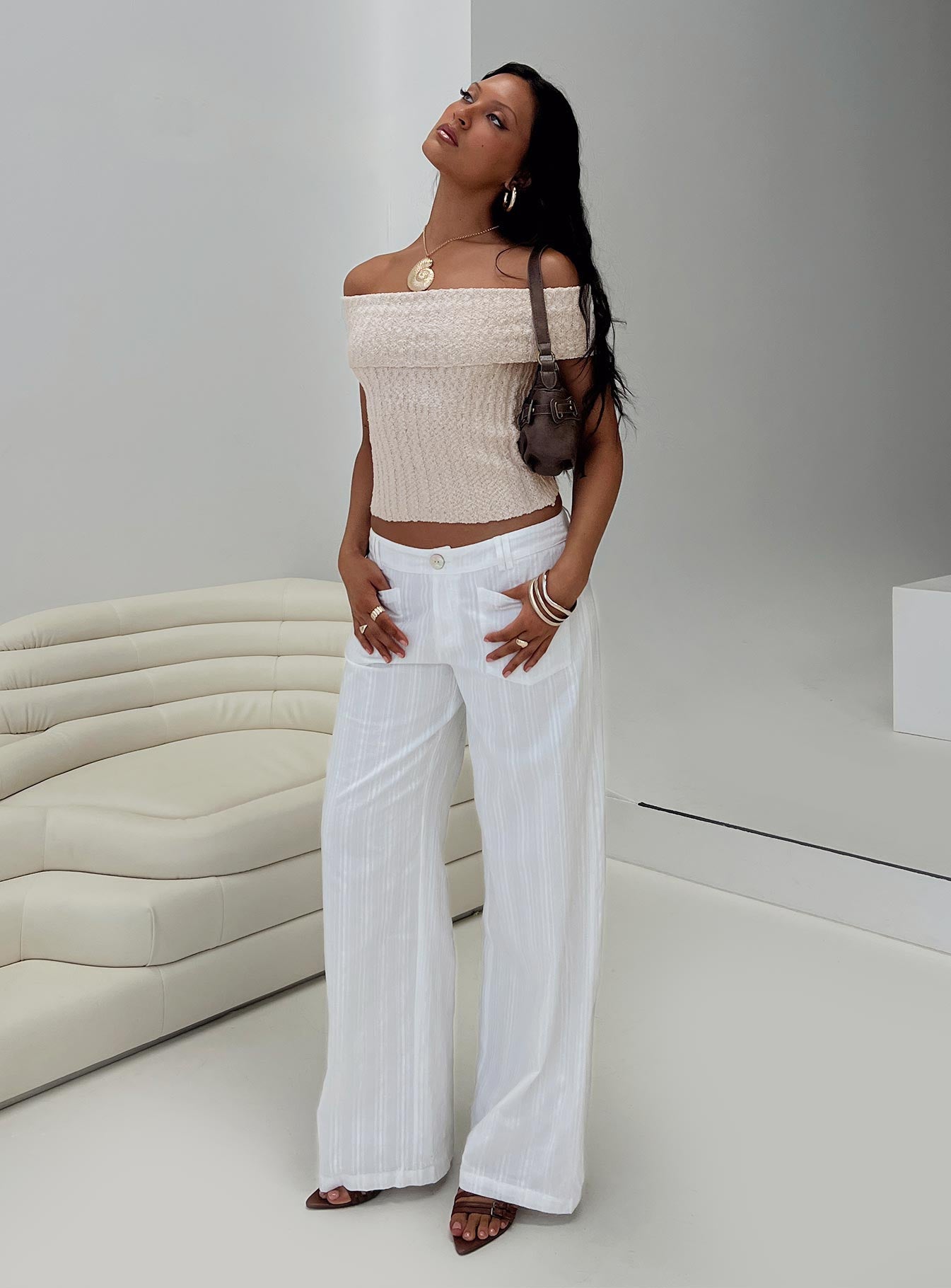 side view of model wearing Princess Polly Vendi Low Rise Pant White Low Rise Pants 