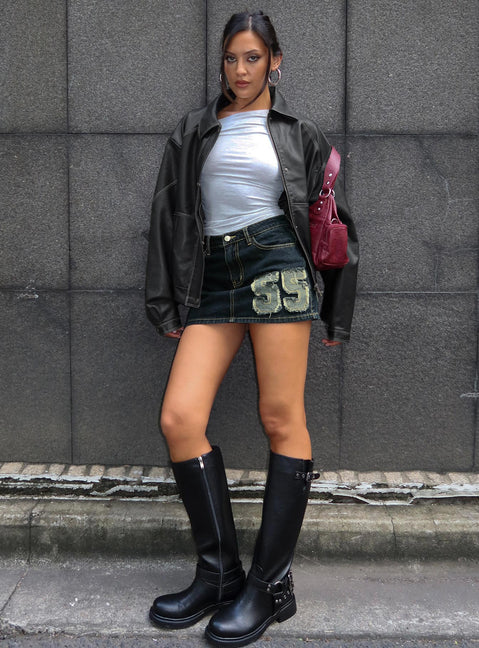   side view of model wearing Princess Polly Standout Patch Detail Denim Skort Blue Mini Skirts 