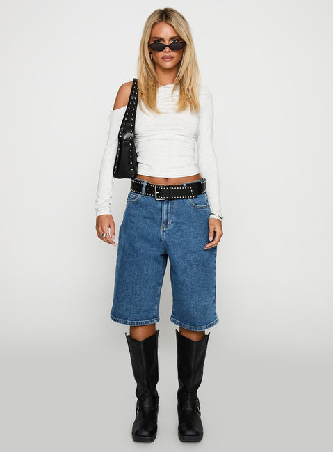 front view of model wearing Princess Polly Retro Dream Mid Rise Longline Denim Shorts Mid Wash Low Rise Shorts 