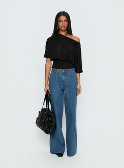 side view of model wearing Princess Polly Naylor Mid Rise Wide Leg Jeans Mid Blue Wash Mid Rise Jeans 