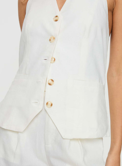 White Matching linen set Halter neck top, fixed halter strap, button fastening at front, twin hip pockets High rise pants, belt looped waist, zip and button fastening, elasticated waistband at back, twin hip pockets, straight leg