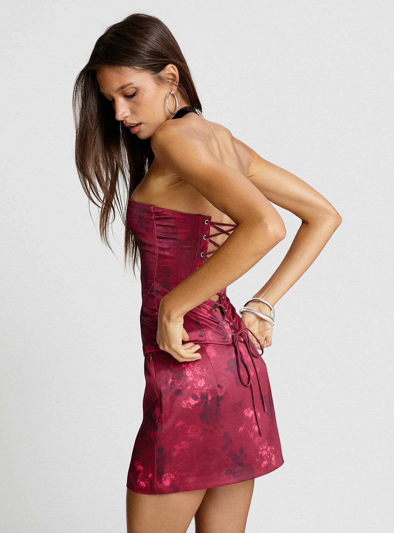 back view of model wearing Princess Polly Lovesita Bow Mini Skirt Red Floral Mini Skirts 