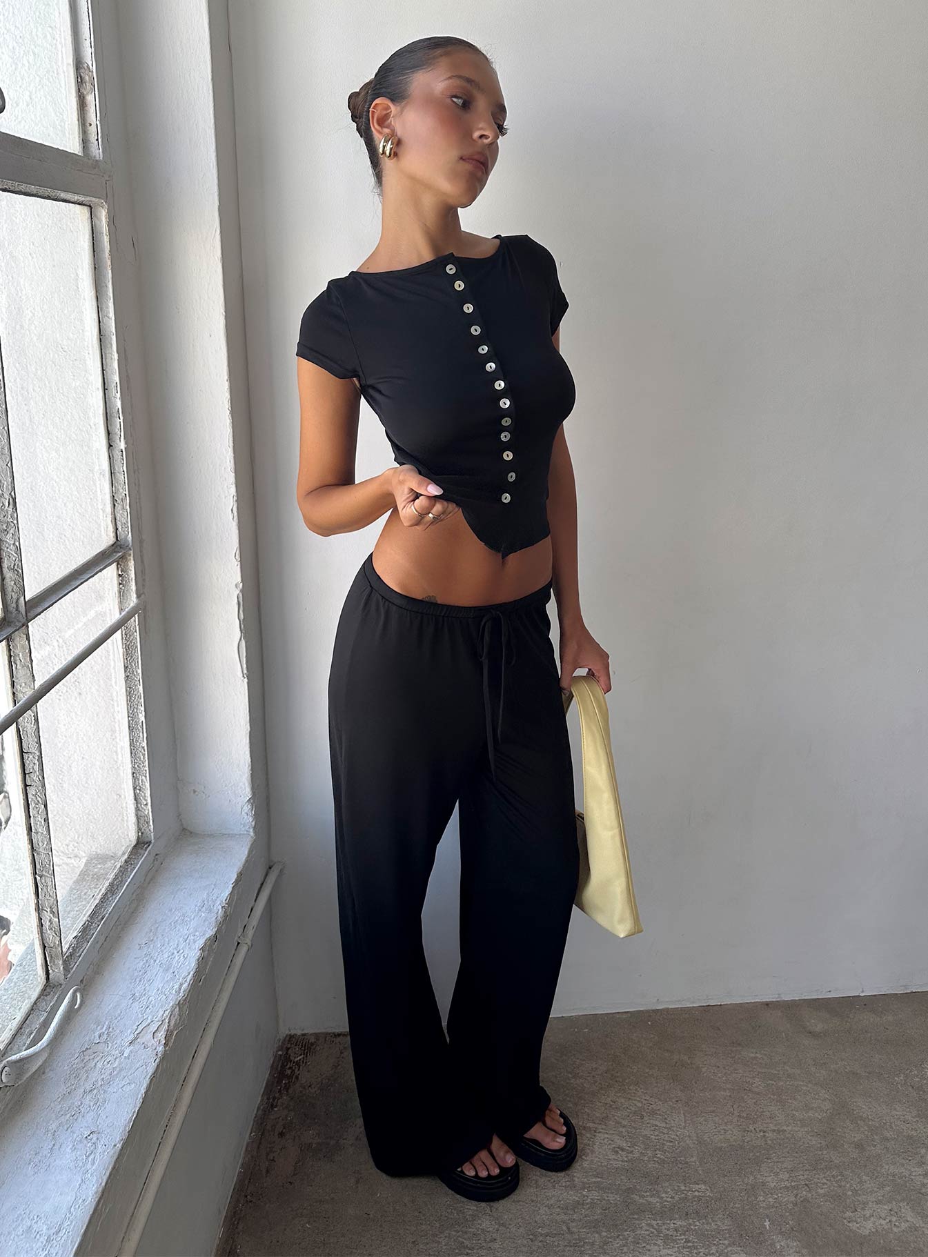 front view of model wearing Princess Polly Gavrielle Jersey Wide Leg Pants Black High Rise Pants 