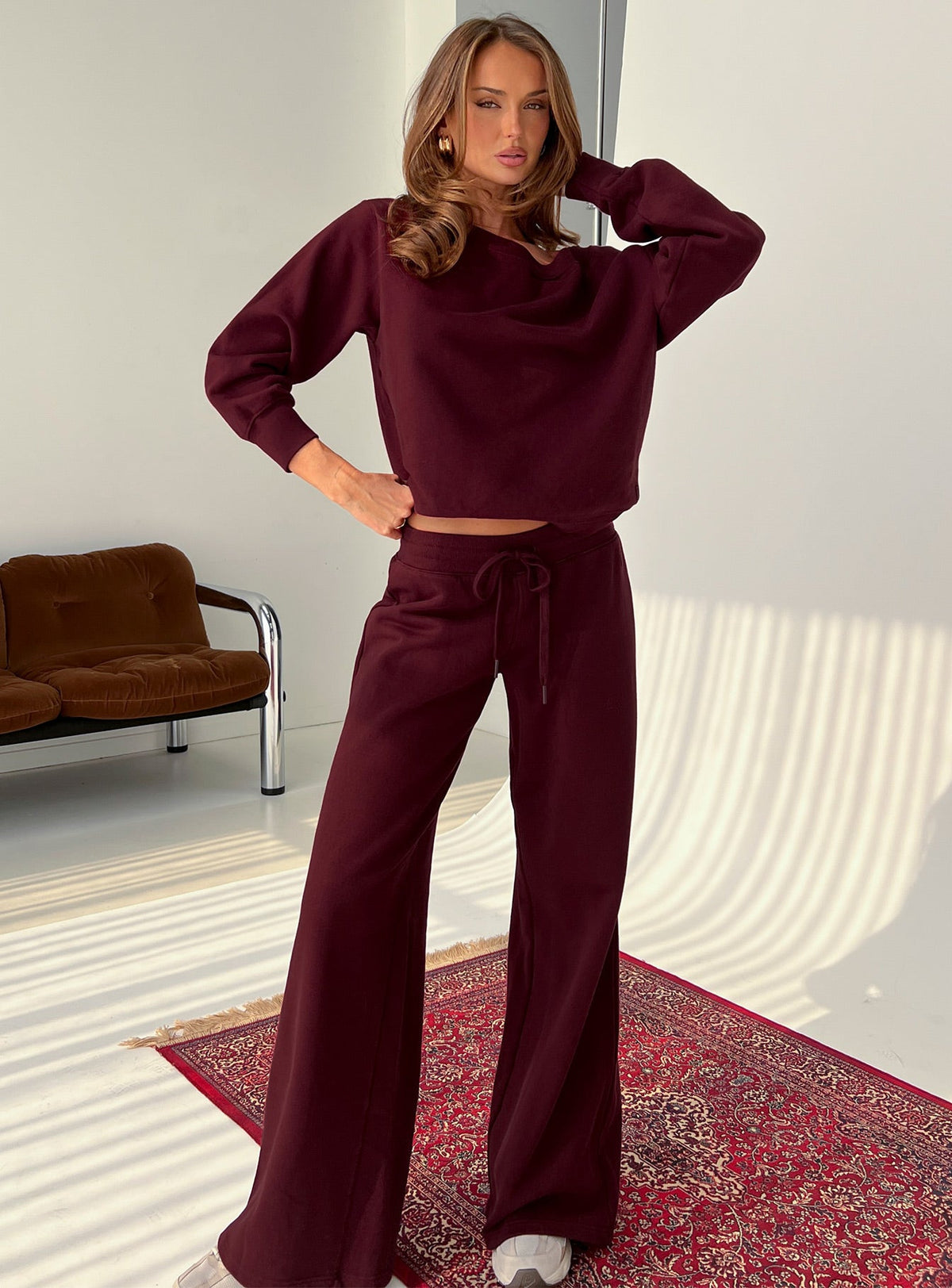 front view of model wearing Princess Polly Wellness Off the Shoulder Jumper Currant cropped Jumpers 